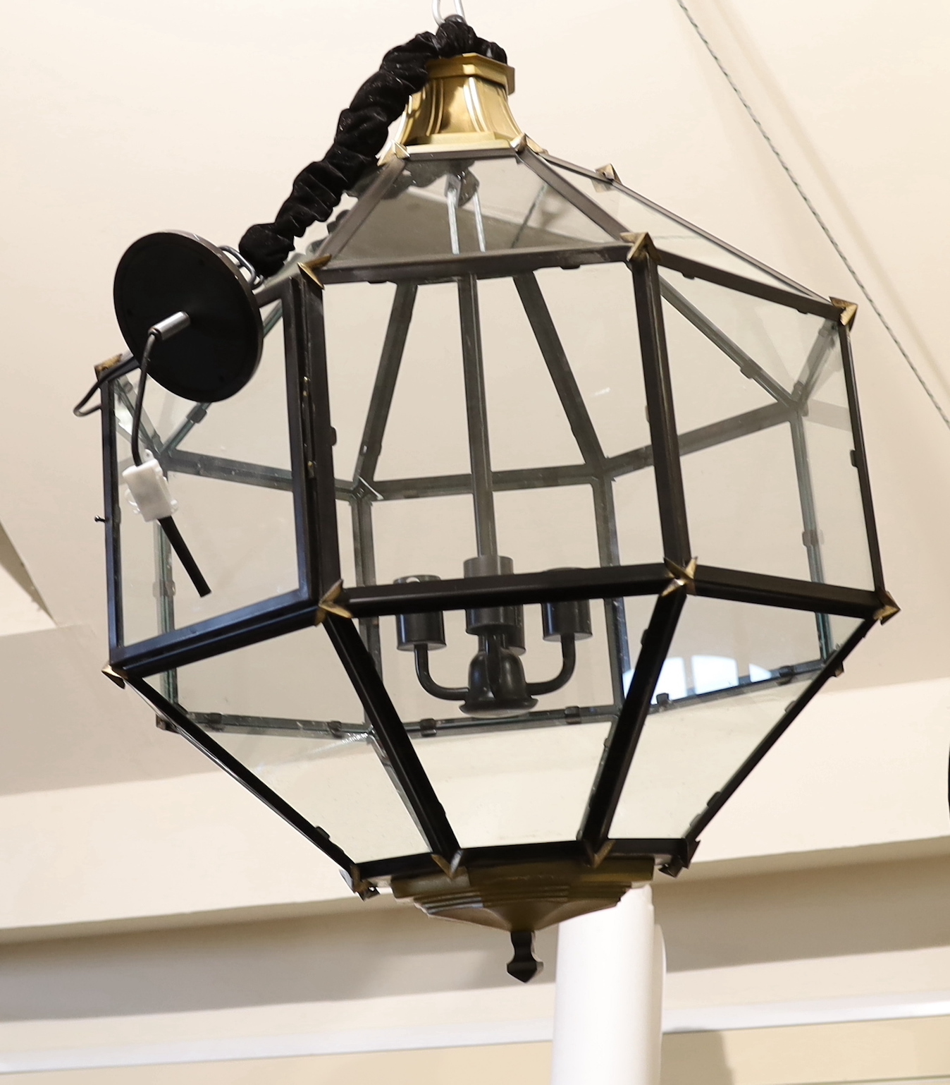 A pair of contemporary bronzed and black painted octagonal lanterns, 64cm wide, 90cm high